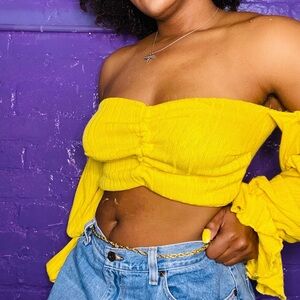 Yellow ribbed knit off the shoulder crop top